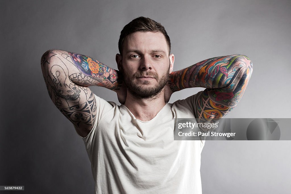 Tattooed Male, Hands on Neck.