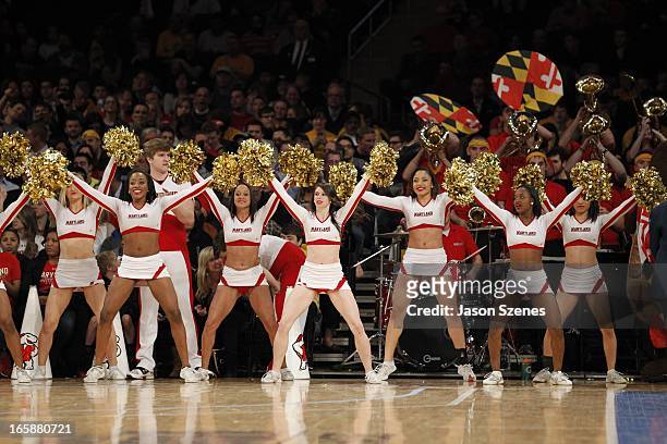 The Maryland Terapins cheerleaders in action against the Iowa Hawkeyes in the first half during the 2013 NIT Championship - Semifinals at the Madison...