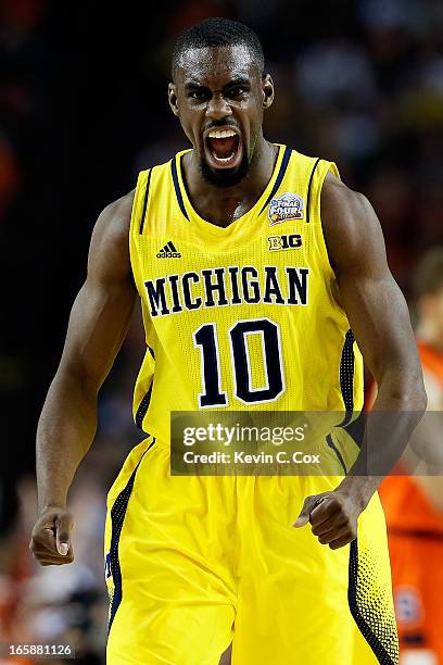 Tim Hardaway Jr. #10 of the Michigan Wolverines reacts in the first half against the Syracuse Orange during the 2013 NCAA Men's Final Four Semifinal...