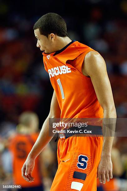 Michael Carter-Williams of the Syracuse Orange reacts in the second half against the Michigan Wolverines during the 2013 NCAA Men's Final Four...