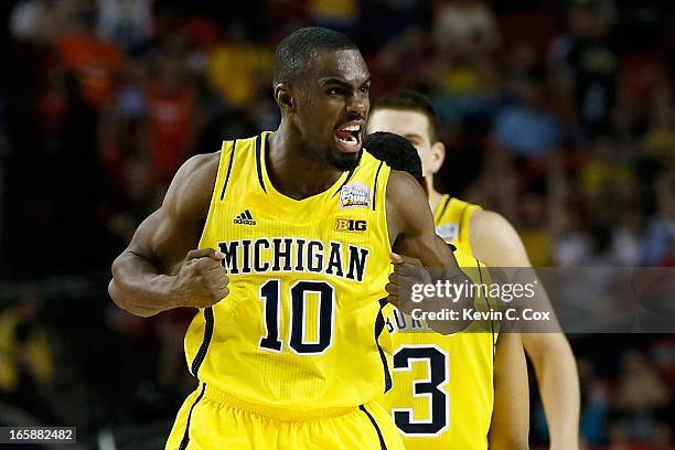 Tim Hardaway Jr. #10 of the Michigan Wolverines reacts in the second half against the Syracuse Orange during the 2013 NCAA Men's Final Four Semifinal...