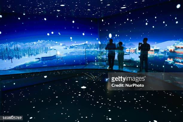 Tourists view a panoramic animation at a digital exhibition hall in Jinling town in Nanjing, East China's Jiangsu province, Sept 10, 2023. The...