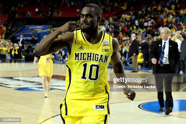 Tim Hardaway Jr. #10 of the Michigan Wolverines celebrates the Wolverines 61-56 victory against the Syracuse Orange during the 2013 NCAA Men's Final...