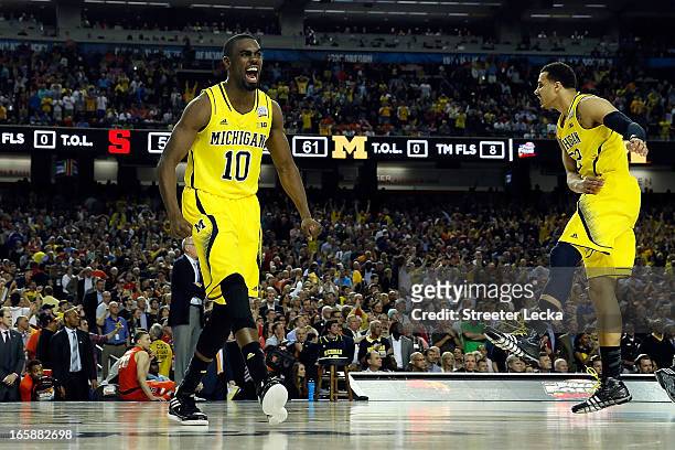 Tim Hardaway Jr. #10 of the Michigan Wolverines celebrates the Wolverines 61-56 victory against the Syracuse Orange during the 2013 NCAA Men's Final...