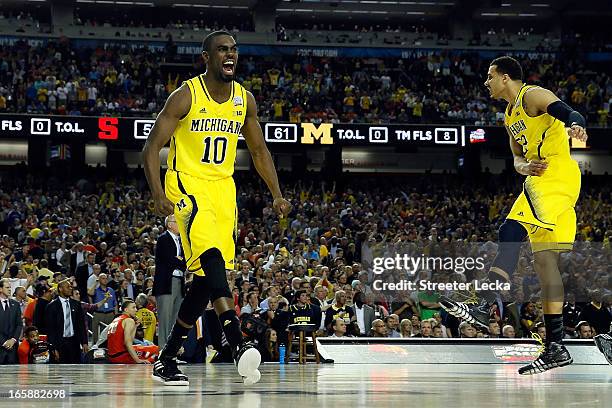 Tim Hardaway Jr. #10 of the Michigan Wolverines celebrates the Wolverines 61-56 victory against the Syracuse Orange during the 2013 NCAA Men's Final...