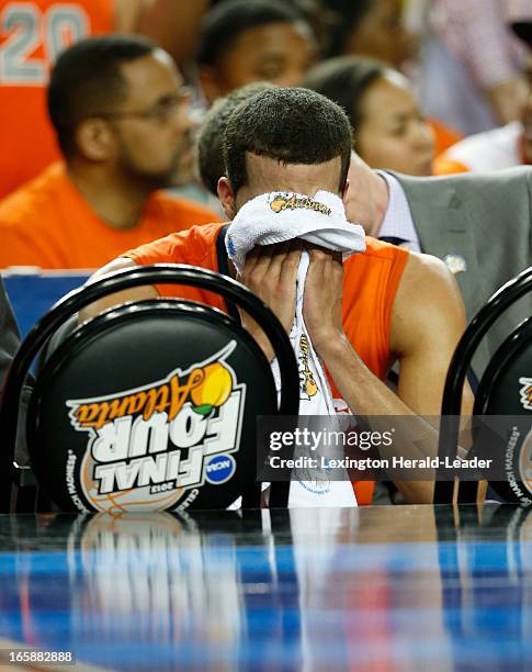 Michael Carter-Williams of the Syracuse Orange after fouling out in the second half against in an NCAA Final Four semifinal at the Georgia Dome in...