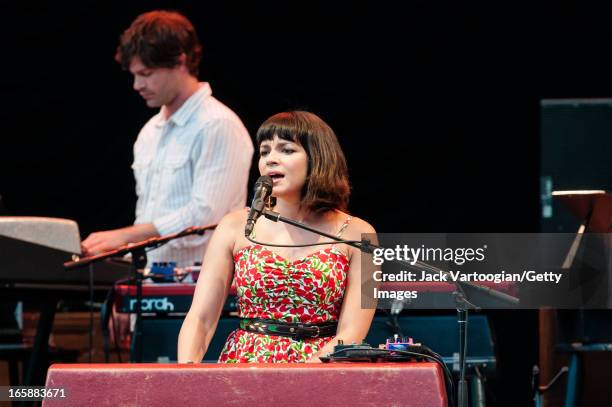 American jazz and pop musician Norah Jones performs at a Benefit for Central Park SummerStage, New York, New York, July 3, 2012. Also visible, Pete...