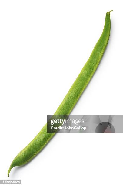 a bright green runner bean on a white background - runner beans stock pictures, royalty-free photos & images