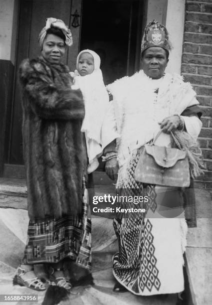 Nigerian lawyer and activist Ladipo Solanke pictured with his wife Opeolu and their baby following the infant's christening in London, November 4th...