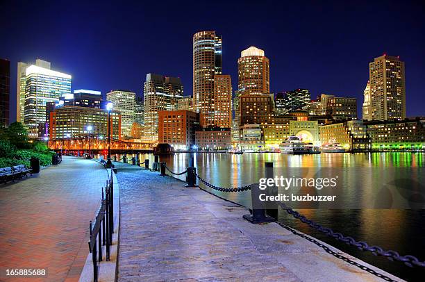 nighttime view of boston from the riverwalk - boston harbour stock pictures, royalty-free photos & images