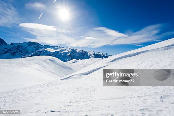 high mountain landscape with sun - snö bildbanksfoton och bilder
