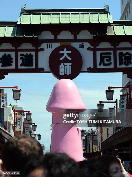 Phallus-shaped portable shrine is carried during the Kanamara festival near the Kanayama shrine in Kawasaki, Kanagawa prefecture on April 7, 2013....