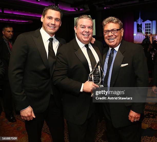 Alex Carr, Elvis Duran and Uncle Johnny pose with the Imperial Diamond Award at the 27th Annual Night Of A Thousand Gowns at the Hilton New York on...
