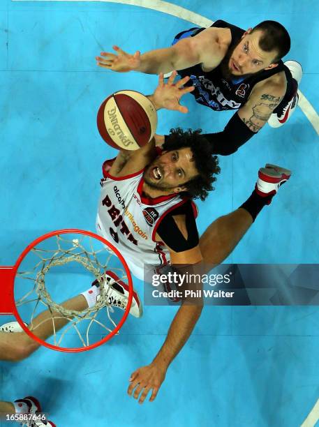 Matthew Knight of the Wildcats dunks the ball under pressure from Will Hudson of the Breakers during game one of the NBL Grand Final series between...