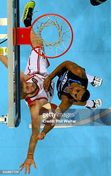 Corey Webster of the Breakers shoots under pressure from Jesse Wagstaff of the Wildcats during game one of the NBL Grand Final series between the New...