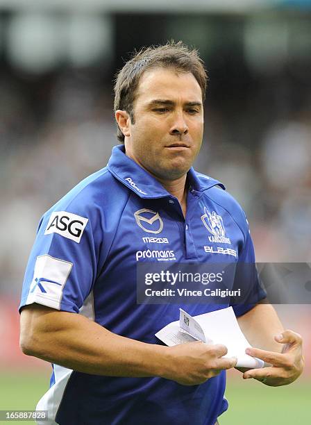 Kangaroos coach Brad Scott leaves the ground at 3/4 time during the round two AFL match between the Geelong Cats and the North Melbourne Kangaroos at...