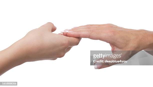 young woman hand holding  mature hand isolated - red couple stockfoto's en -beelden