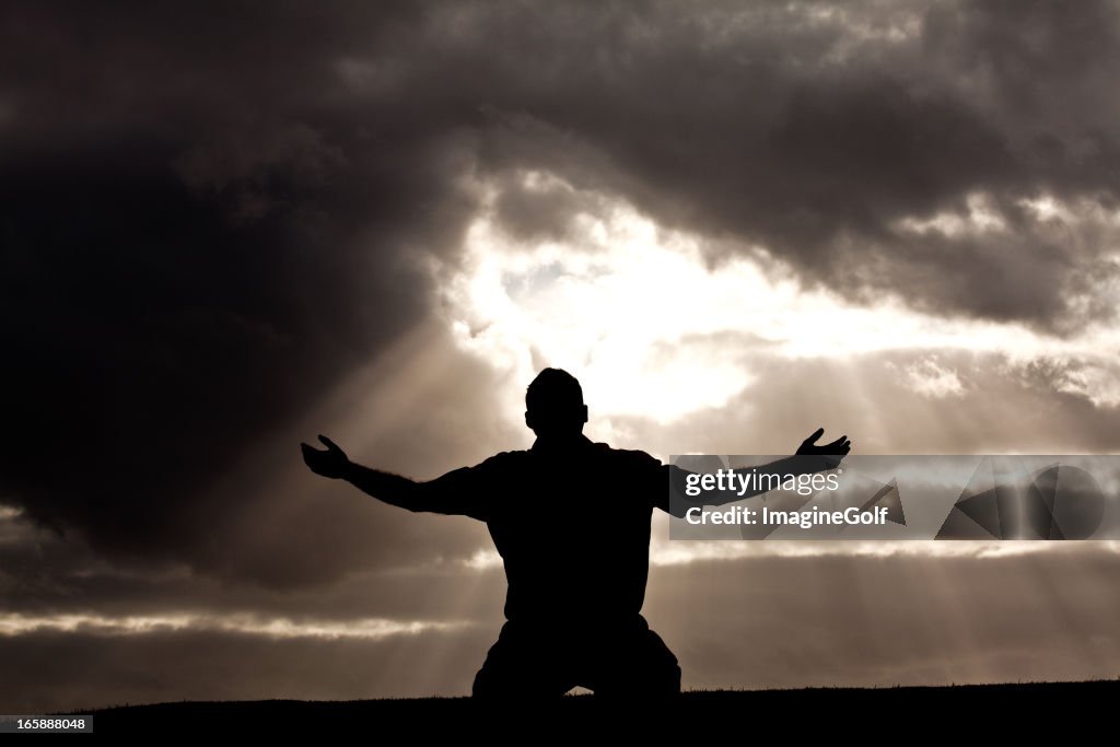 Silhouette of Unrecognizable Man in Worship Silhouette