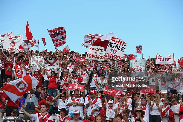 Dragons supporters cheer as their team takes the field for the round five NRL match between the St George Illawarra Dragons and the Newcastle Knights...