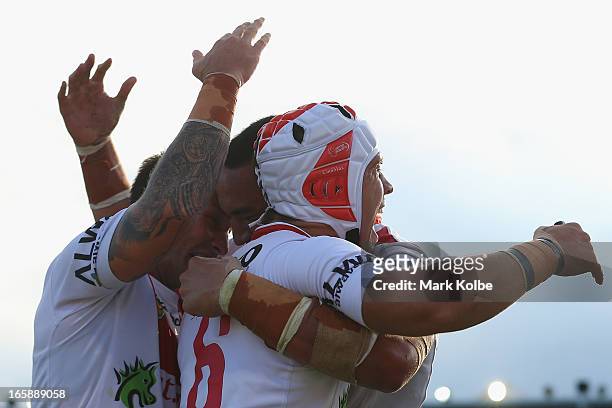 Jamie Soward and Nathan Fien of the Dragons celebrate after Jason Nightingale of the Dragons scored a try during the round five NRL match between the...