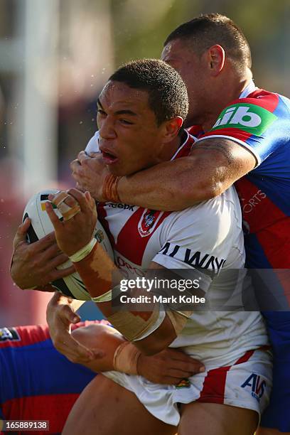 Tyson Frizell of the Dragons is hit in a high tackle during the round five NRL match between the St George Illawarra Dragons and the Newcastle...