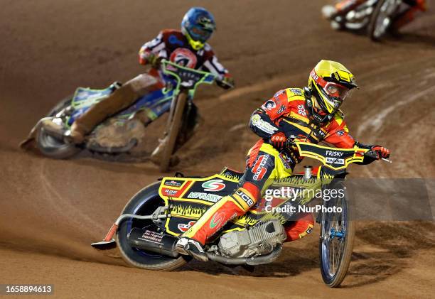 Max James of Leicester 'Watling JCB' Lion Cubs leads Luke Muff of Belle Vue 'Cool Running' Colts during the National Development League match between...