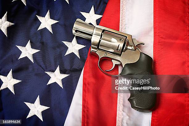 gun on american flag - gun control stock pictures, royalty-free photos & images