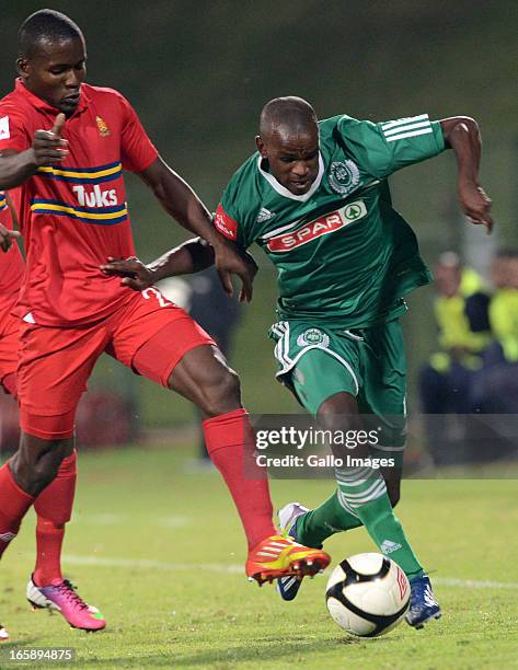 Roland Ketjijere tackles Ayanda Dlamini during the Absa Premiership match between University of Pretoria and AmaZulu at Tuks Stadium on April 06,...