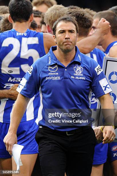 Kangaroos coach Brad Scott walks off the ground at 3/4 time during the round two AFL match between the Geelong Cats and the North Melbourne Kangaroos...