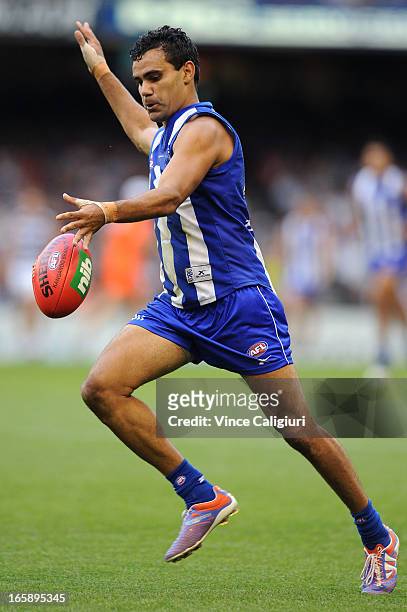 Lindsay Thomas of the Kangaroos kicks the ball during the round two AFL match between the Geelong Cats and the North Melbourne Kangaroos at Etihad...