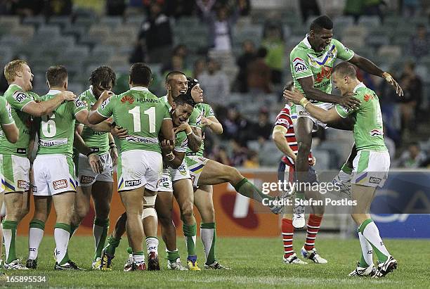 Raiders players celebrate after winning the round five NRL match between the Canberra Raiders and the Sydney Roosters at Canberra Stadium on April 7,...