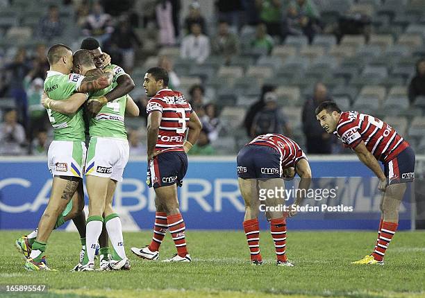 Raiders players celebrate after winning the round five NRL match between the Canberra Raiders and the Sydney Roosters at Canberra Stadium on April 7,...