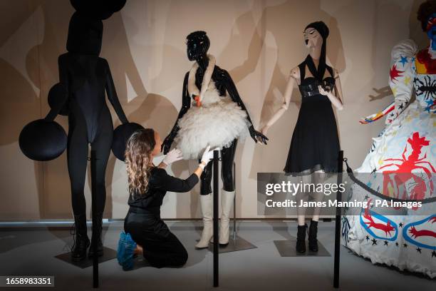 Elise Foster Vander Els, Head of Exhibitions at the Design Museum looks at the swan dress, worn by Bjork at the 2001 Oscars, on show during a...
