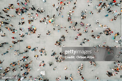 Aerial shot of people walking on the gay pride parade Aerial shot of people walking on the gay pride parade