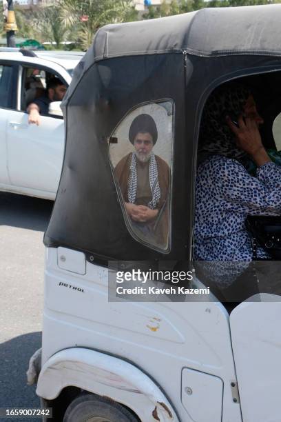 Poster of Muqtada al-Sadr is posted on the body of an auto rickshaw in Sadr City on March 18, 2023 in Baghdad, Iraq. Muqtada al-Sadr is a Shiite...