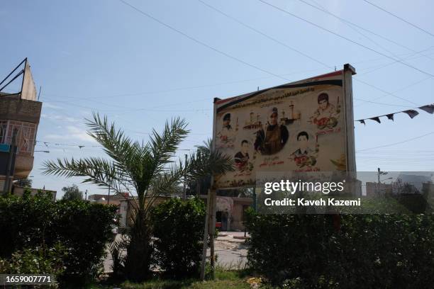 Photos of martyred militia supporters of Muqtada al-Sadr appear on the streets in Sadr City on March 18, 2023 in Baghdad, Iraq. Sadr City is the...