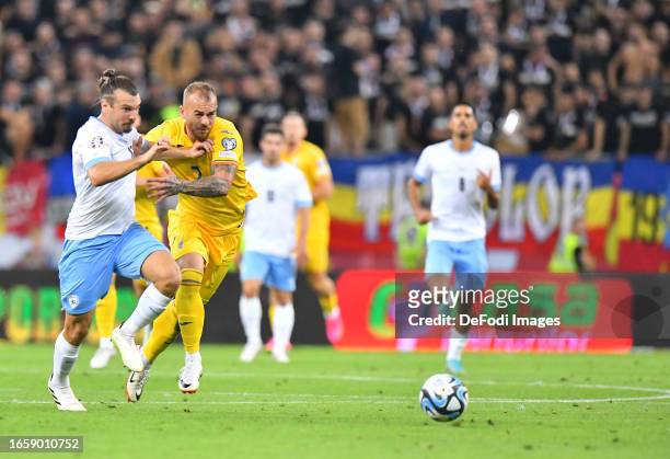 Sean Goldberg fight for bal with Denis Alibec of Romania during the UEFA EURO 2024 European qualifier match between Romania and Israel at National...