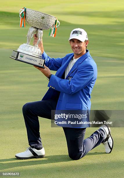 Wade Ormsby of Australia pictured with the winner's trophy after round four of the Panasonic Open India at Delhi Golf Club on April 7, 2013 in New...