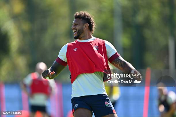 Courtney Lawes of England celebrates after winning a sprint race during a training session at Stade Ferdinand Petit on September 04, 2023 in Le...