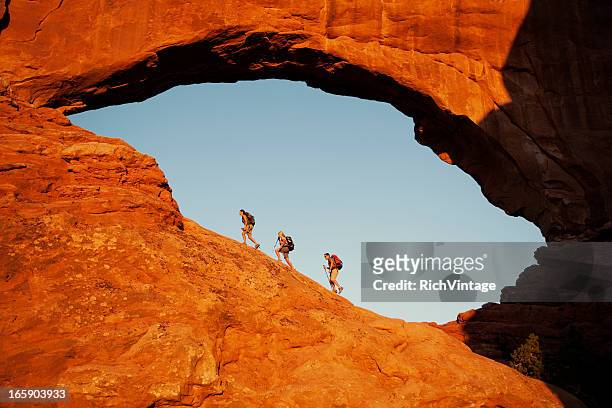 window hikers - utah stock pictures, royalty-free photos & images