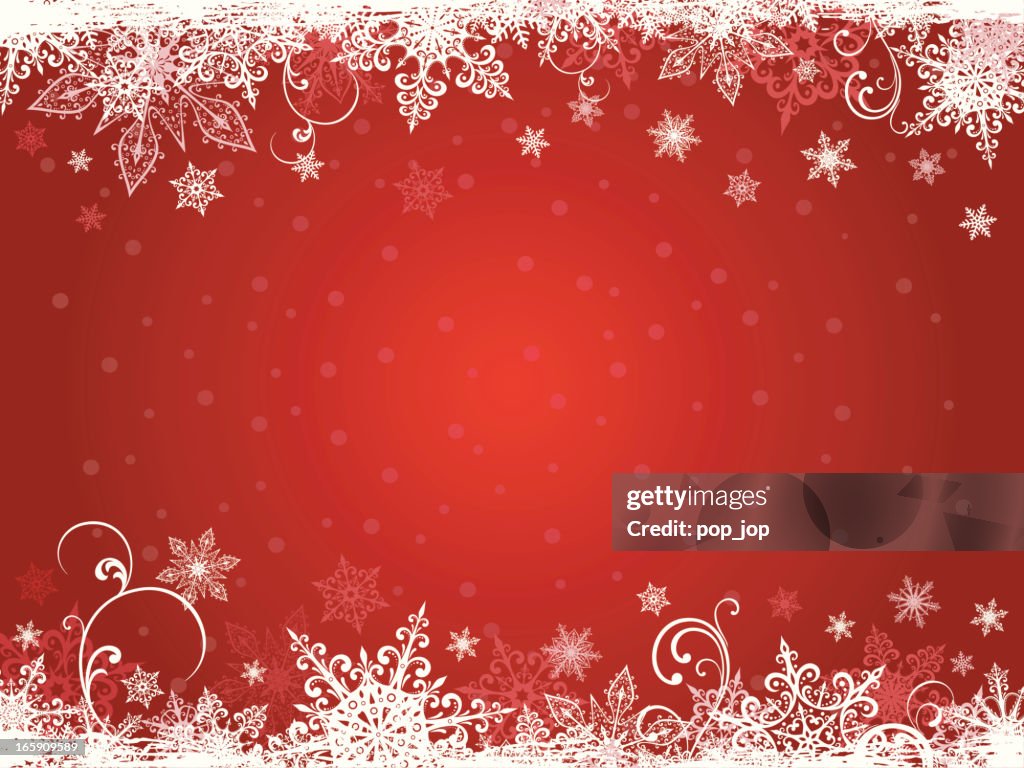 Winter holidays background in white snowflakes and red