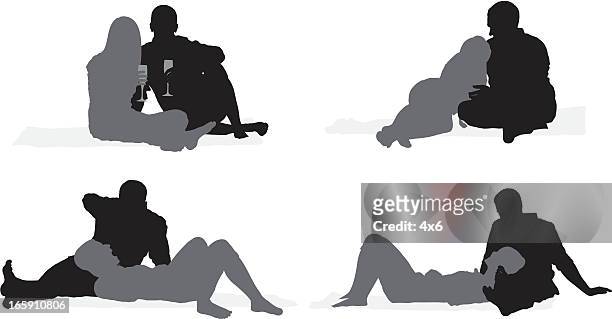 silhouette of a romantic couple - lying on back stock illustrations