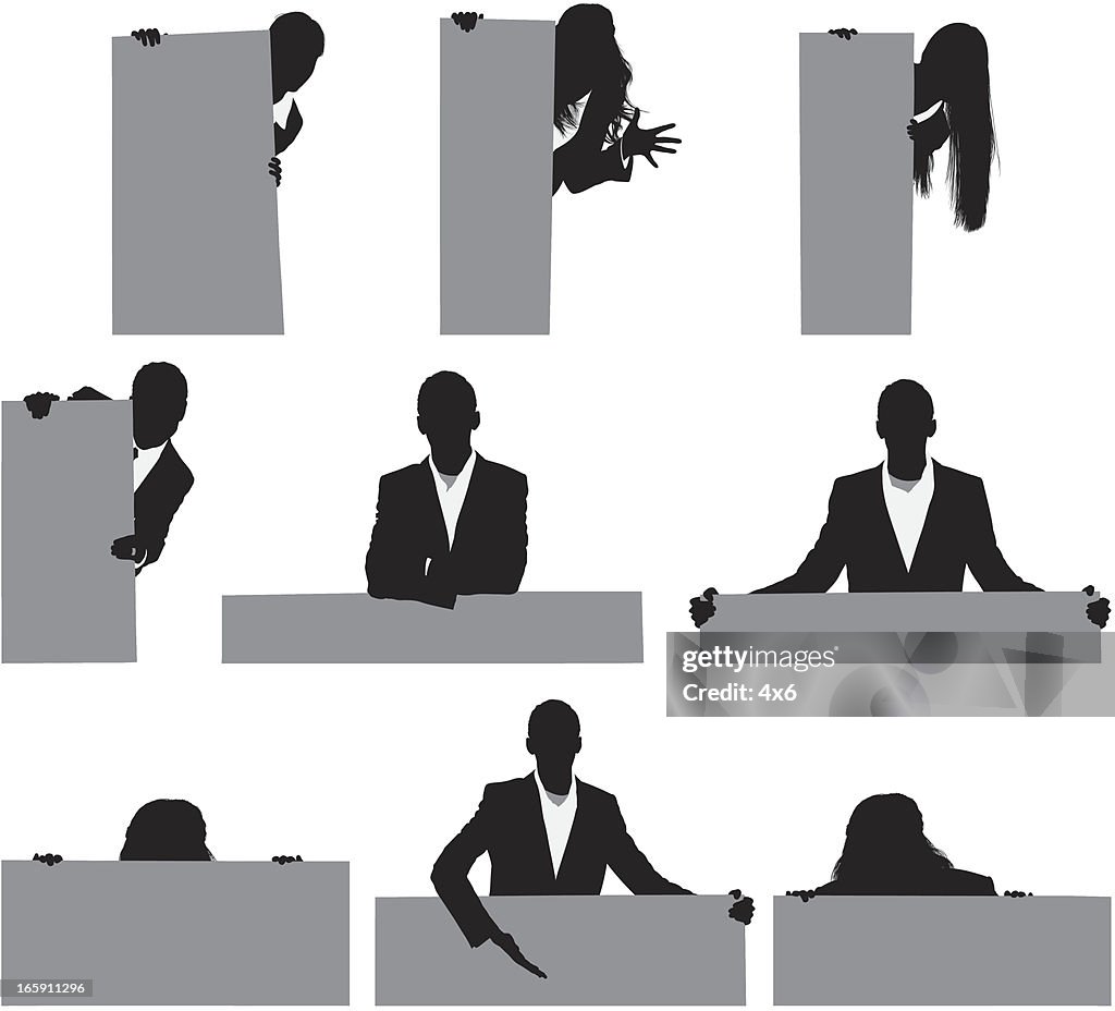 Silhouette of business executives with placards