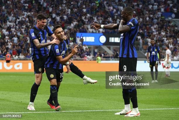 Lautaro Martinez of FC Internazionale celebrates with his team-mates Marcus Thuram and Alessandro Bastoni after scoring the team's second goal during...