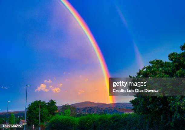 rainbow over  mountains - mountain range icon stock pictures, royalty-free photos & images