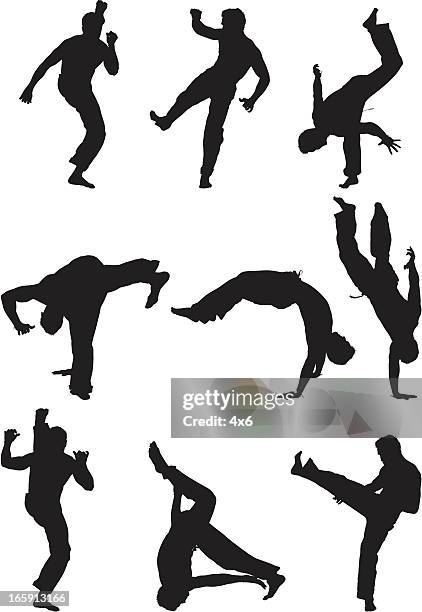 man practicing martial arts - capoeira 幅插畫檔、美工圖案、卡通及圖標