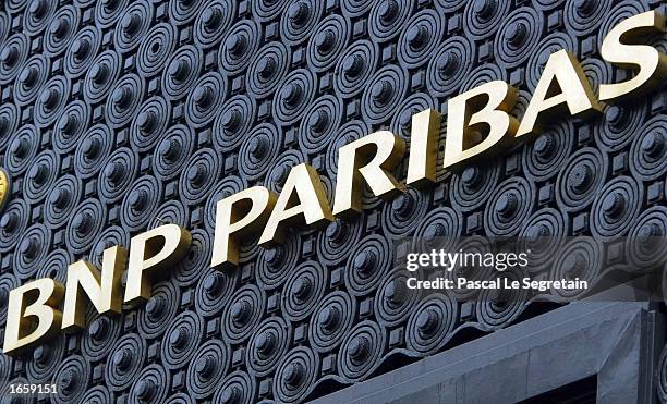 The sign for the BNP Parisbas headquarters is seen at its entrance November 25, 2002 in Paris. The French government sold its 10.9 percent stake in...