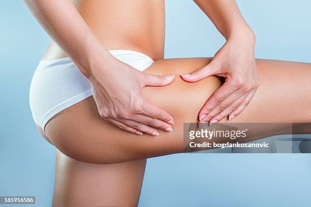 cellulite - female backside fotografías e imágenes de stock