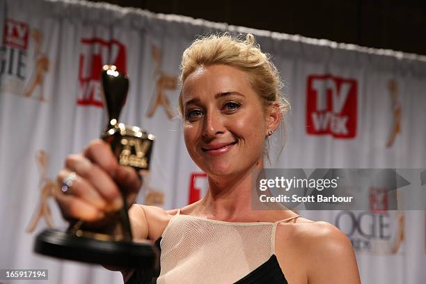 Asher Keddie celebrates in the awards room after winning the Gold Logie for Most Popular Personality on Australian Television at the 2013 Logie...