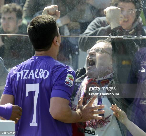 David Pizarro of ACF Fiorentina celebrates in front of fans after scoring his team's second goal from a penalty during the Serie A match between ACF...